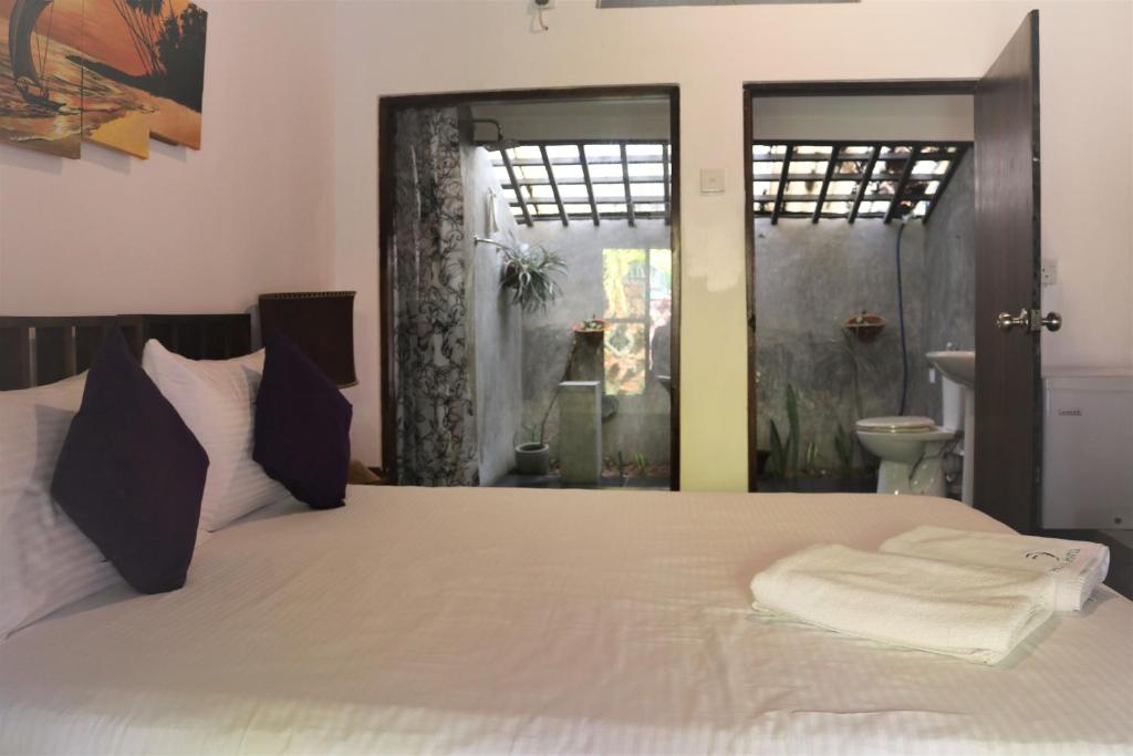 Postel nebo postele na pokoji v ubytování Pavana Hotel