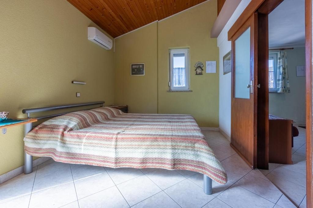 Postel nebo postele na pokoji v ubytování Apartman ELLEN 3