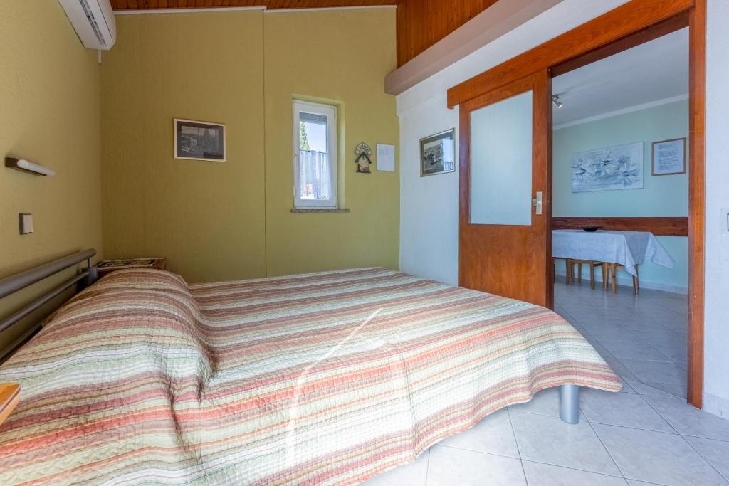 Postel nebo postele na pokoji v ubytování Apartman ELLEN 3