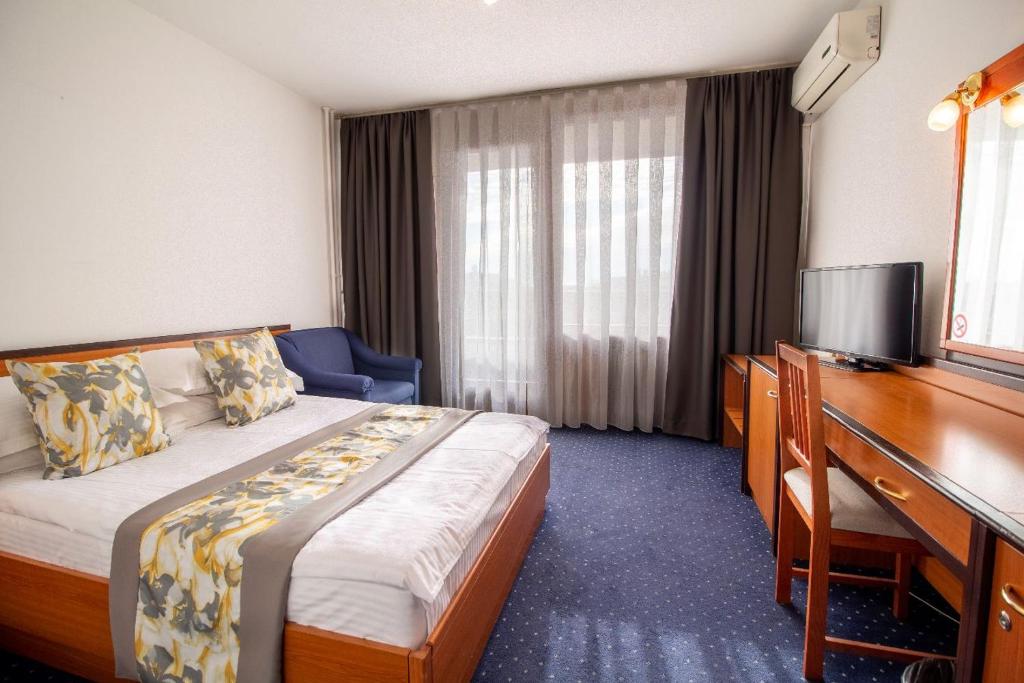 Postel nebo postele na pokoji v ubytování Hotel Novi Zagreb