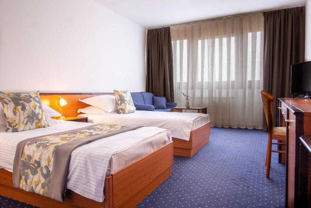 Postel nebo postele na pokoji v ubytování Hotel Novi Zagreb