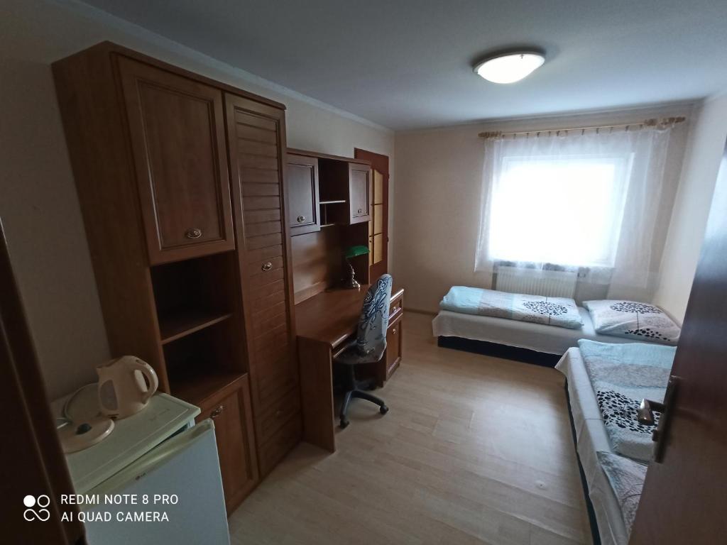 Postel nebo postele na pokoji v ubytování Penzion Modřanka