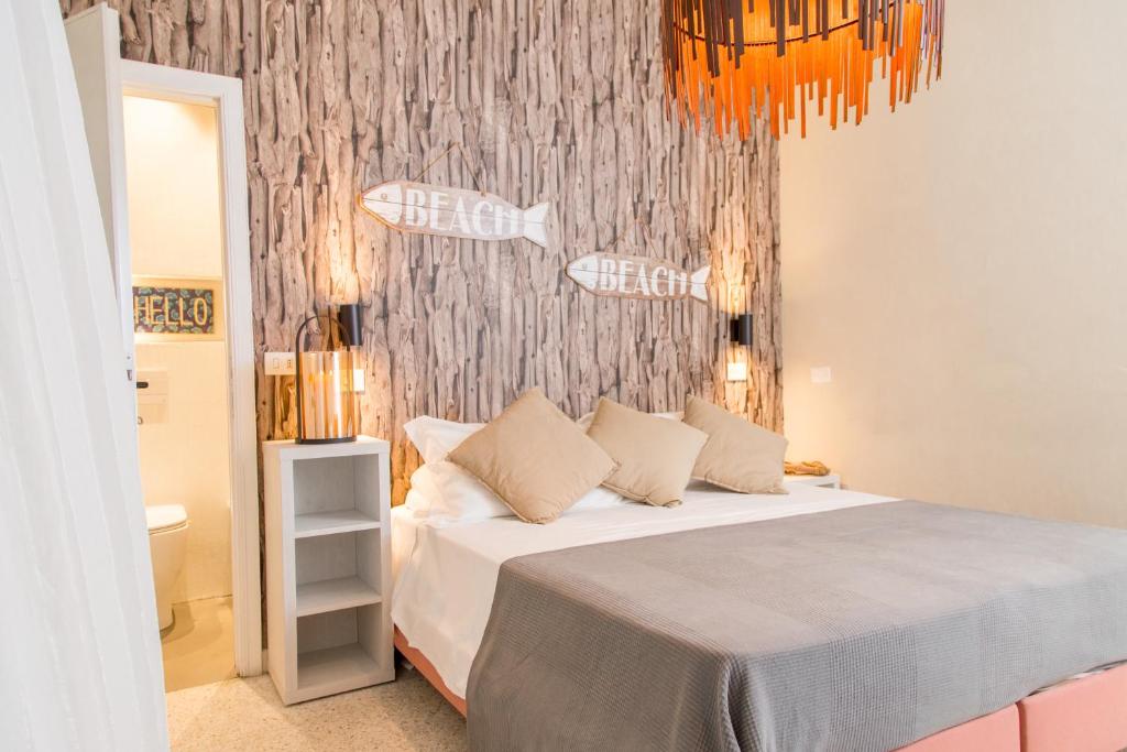 Postel nebo postele na pokoji v ubytování Hotel Rex
