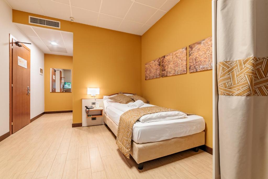 Łóżko lub łóżka w pokoju w obiekcie Hotel all'Orso