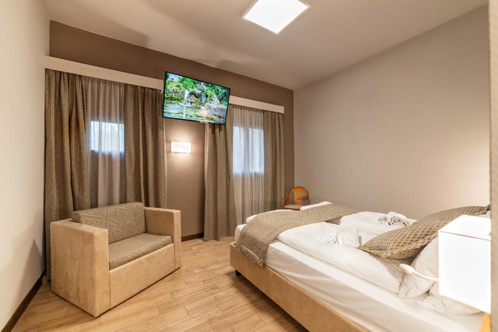 Łóżko lub łóżka w pokoju w obiekcie Hotel all'Orso