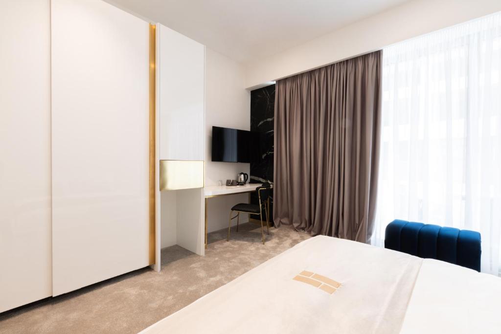 TV a/nebo společenská místnost v ubytování Habitat Hotel Tirana