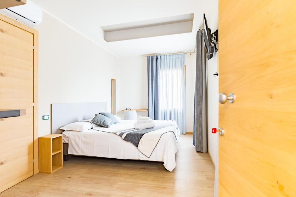 Ένα ή περισσότερα κρεβάτια σε δωμάτιο στο Guest House La Sosta