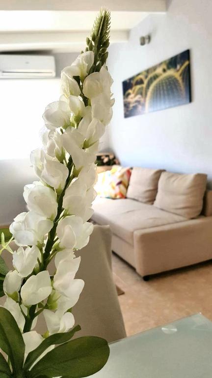 Posezení v ubytování Atico en el corazón de Santa Cruz/ Cozy Penthouse