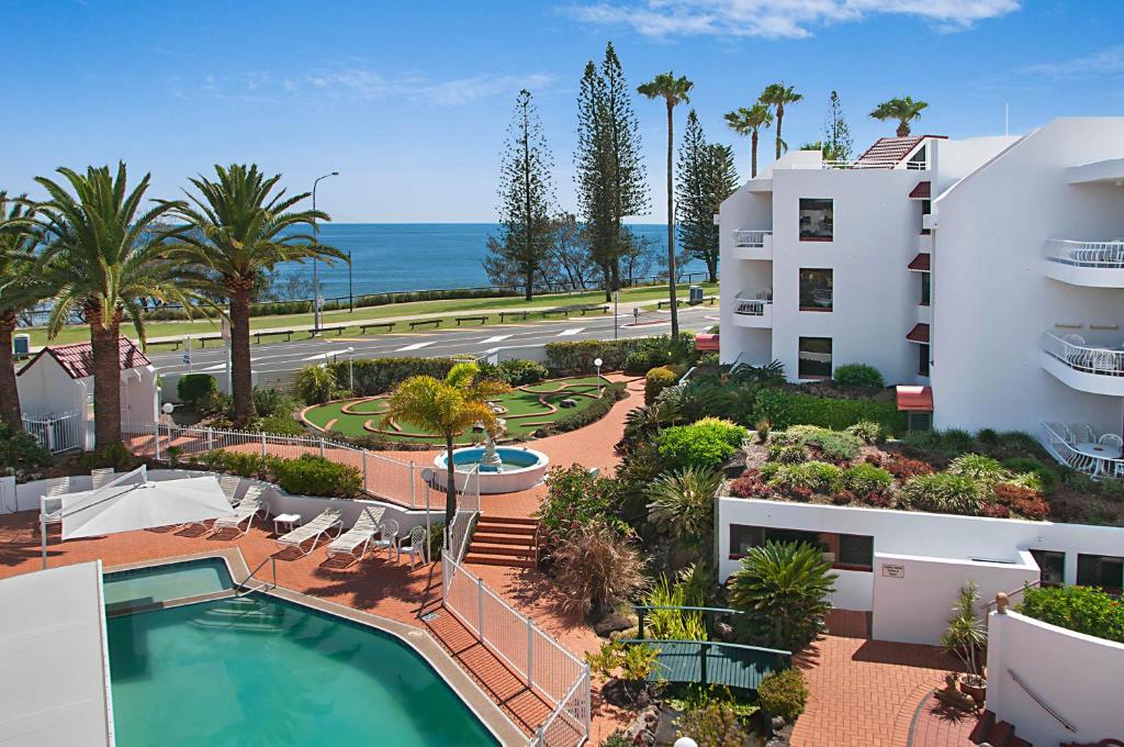 an aerial view of a resort with a swimming pool at Alexandria Apartments in Alexandra Headland