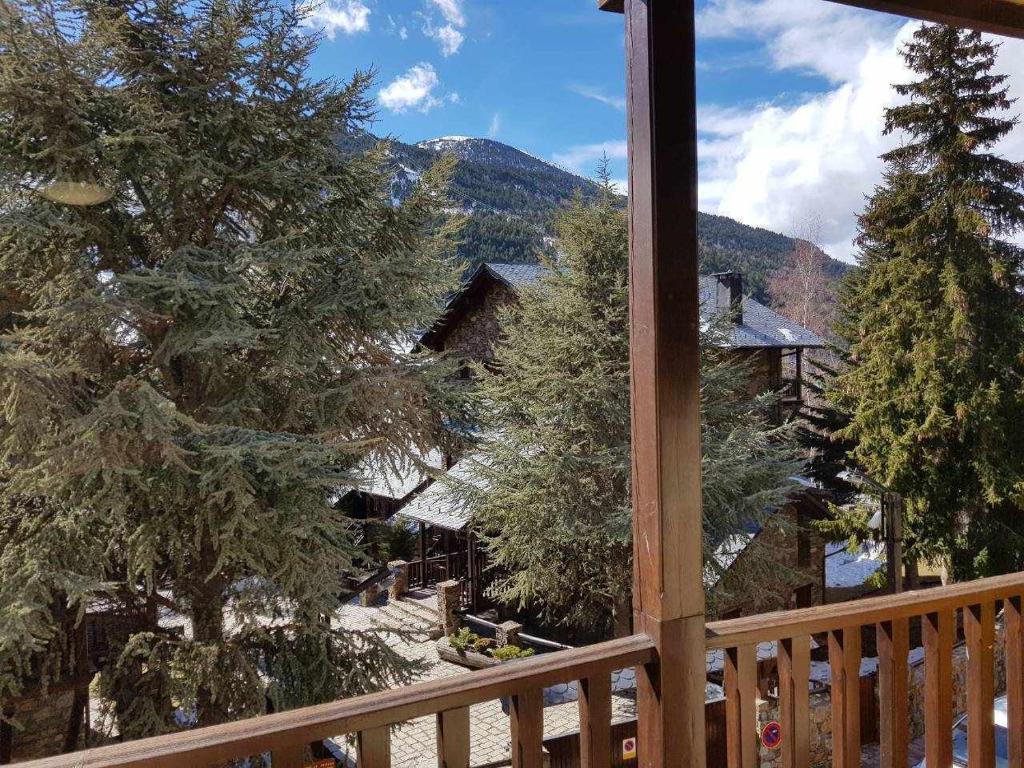 a view from a balcony of a house with trees at Estudio en El Tarter GRANDVALIRA in El Tarter