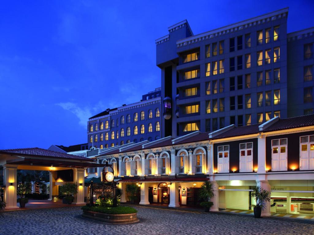 a large building with a clock on the front of it at Village Hotel Albert Court by Far East Hospitality in Singapore