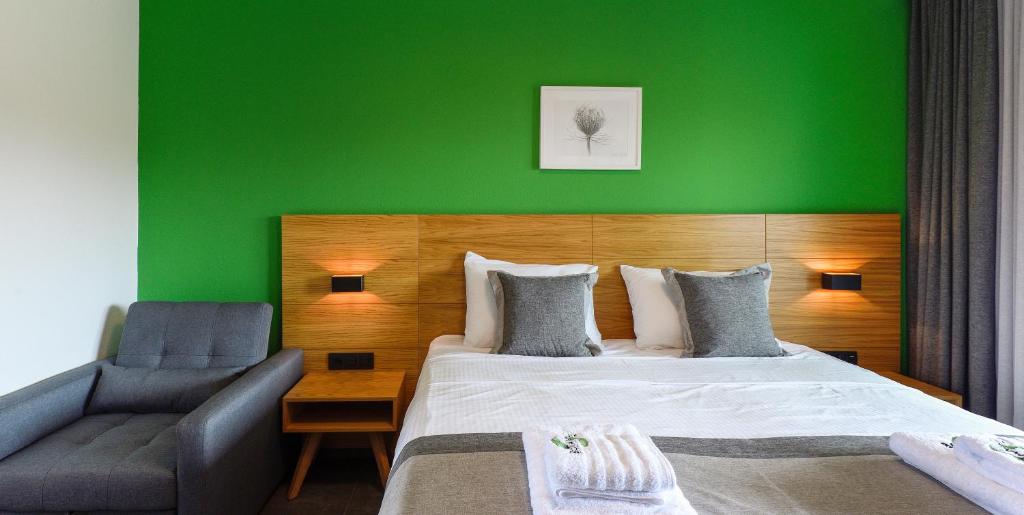 A bed or beds in a room at Botanica Luxury Suites