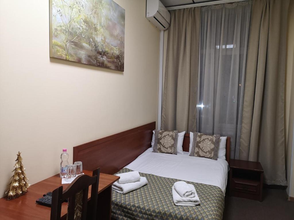 Postel nebo postele na pokoji v ubytování Orange Hotel