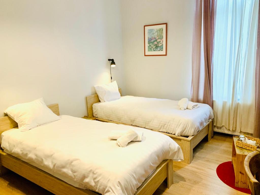 Postel nebo postele na pokoji v ubytování Hotel Du Parlement