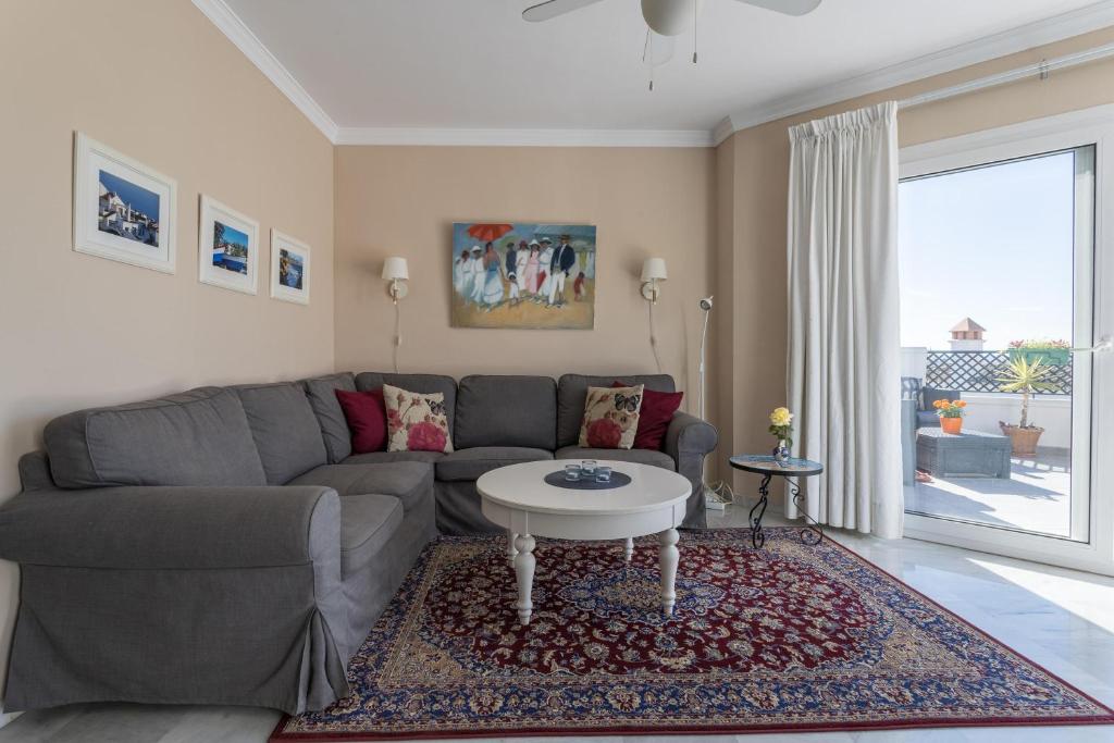 Posezení v ubytování Homely Apartment