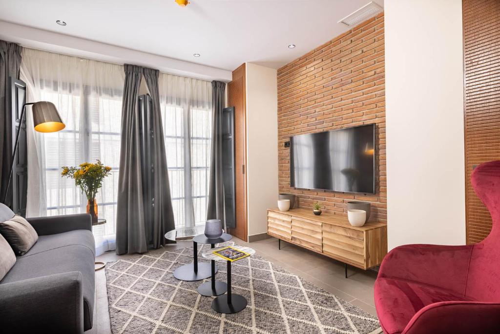 Televízia a/alebo spoločenská miestnosť v ubytovaní Home Art Apartments Soho