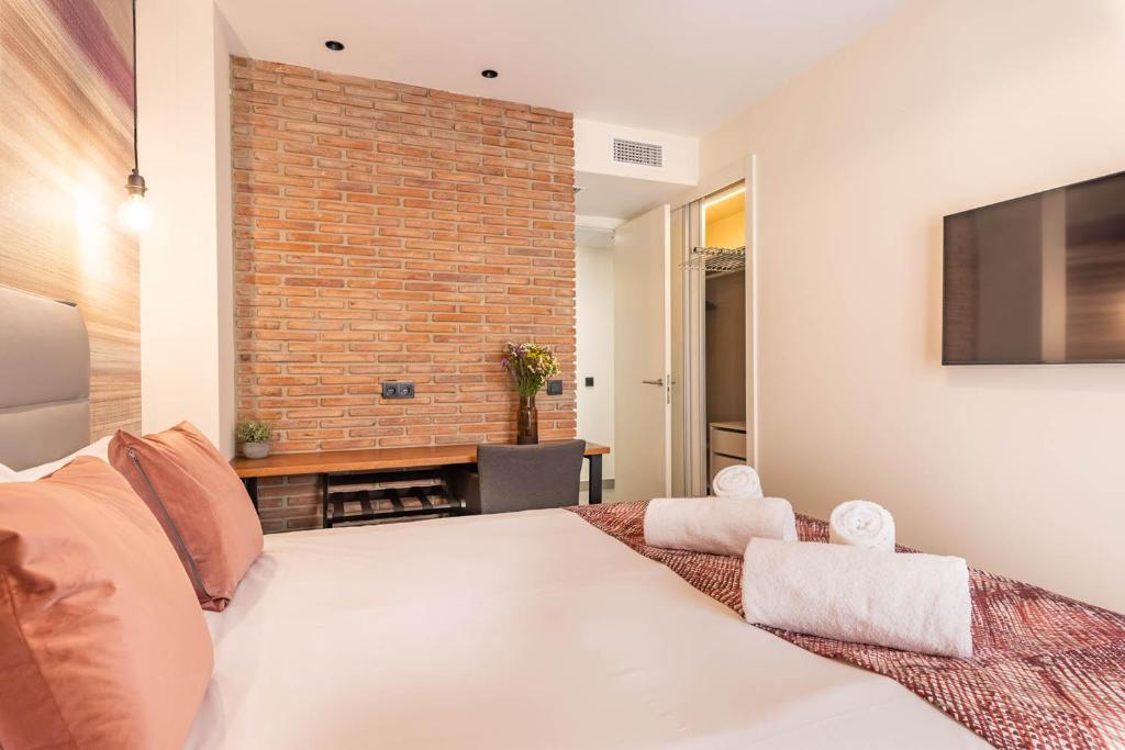 Posteľ alebo postele v izbe v ubytovaní Home Art Apartments Soho
