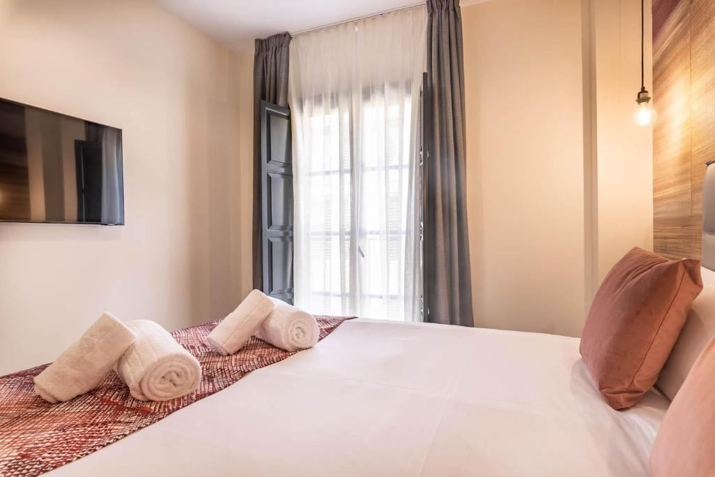 Posteľ alebo postele v izbe v ubytovaní Home Art Apartments Soho
