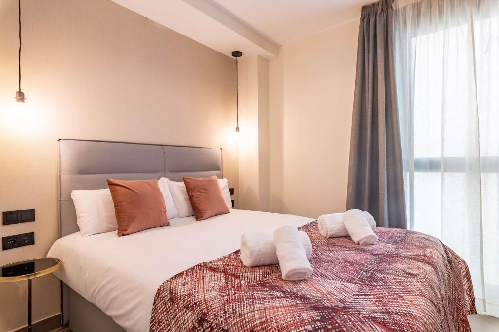 Posteľ alebo postele v izbe v ubytovaní Home Art Apartments Soho