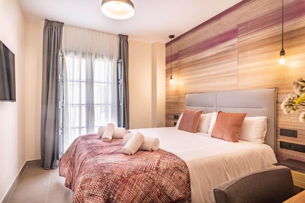 Posteľ alebo postele v izbe v ubytovaní Home Art Apartments Soho