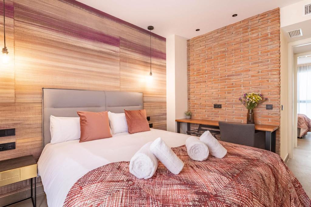 Posteľ alebo postele v izbe v ubytovaní Home Art Apartments Soho