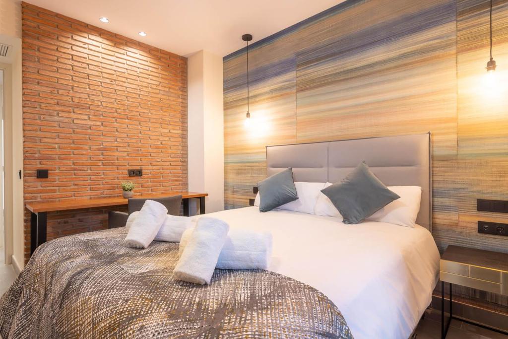 Posteľ alebo postele v izbe v ubytovaní Home Art Apartments Soho