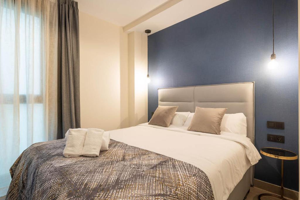 Posteľ alebo postele v izbe v ubytovaní Home Art Apartments Soho