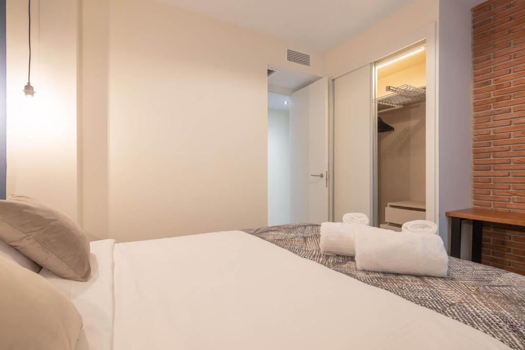 Posteľ alebo postele v izbe v ubytovaní Home Art Apartments Soho