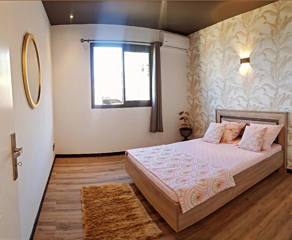 Postel nebo postele na pokoji v ubytování Lilie location manapany 4 étoiles