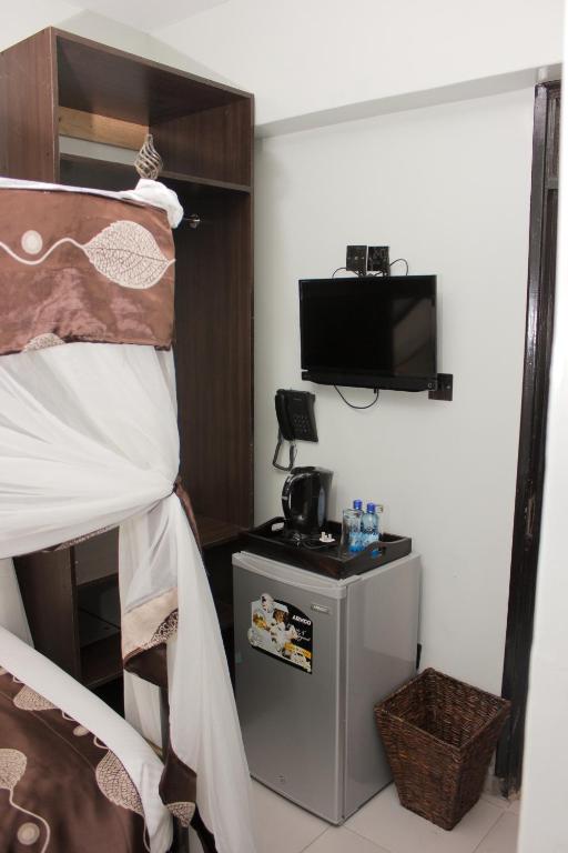 Postel nebo postele na pokoji v ubytování Hadassah Hotel