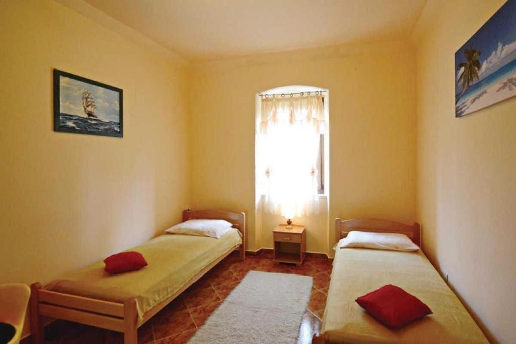 Łóżko lub łóżka w pokoju w obiekcie Villa Ana Labin