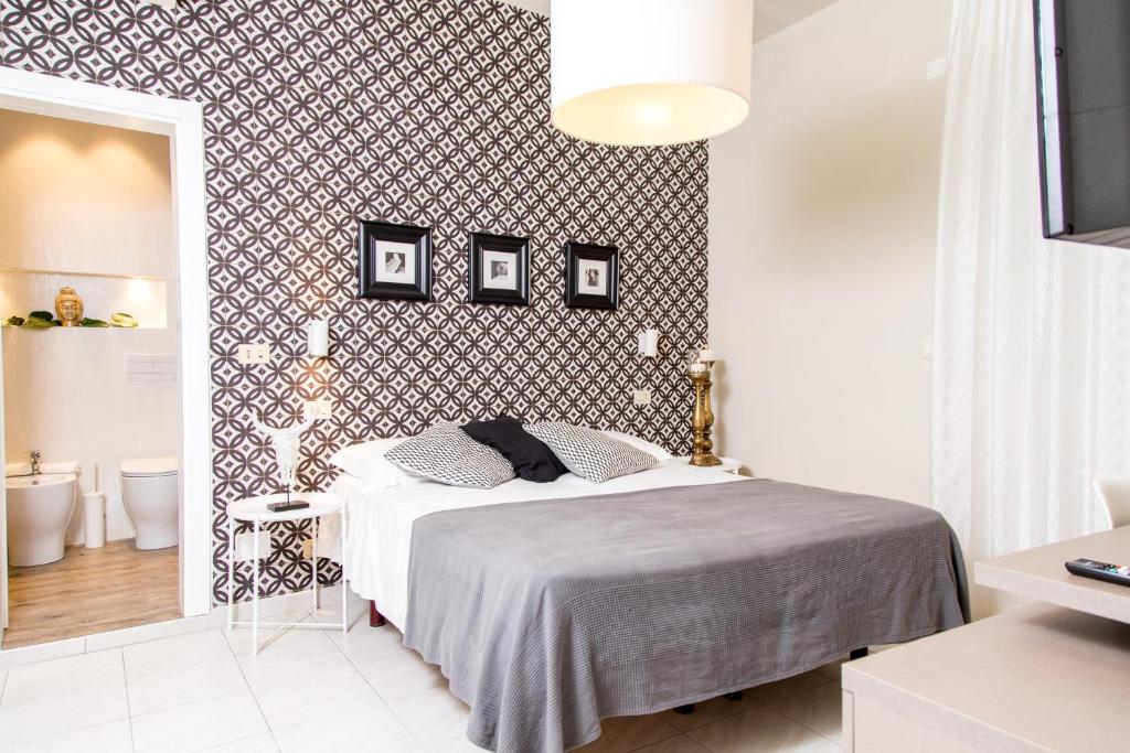 Postel nebo postele na pokoji v ubytování Hotel Rex