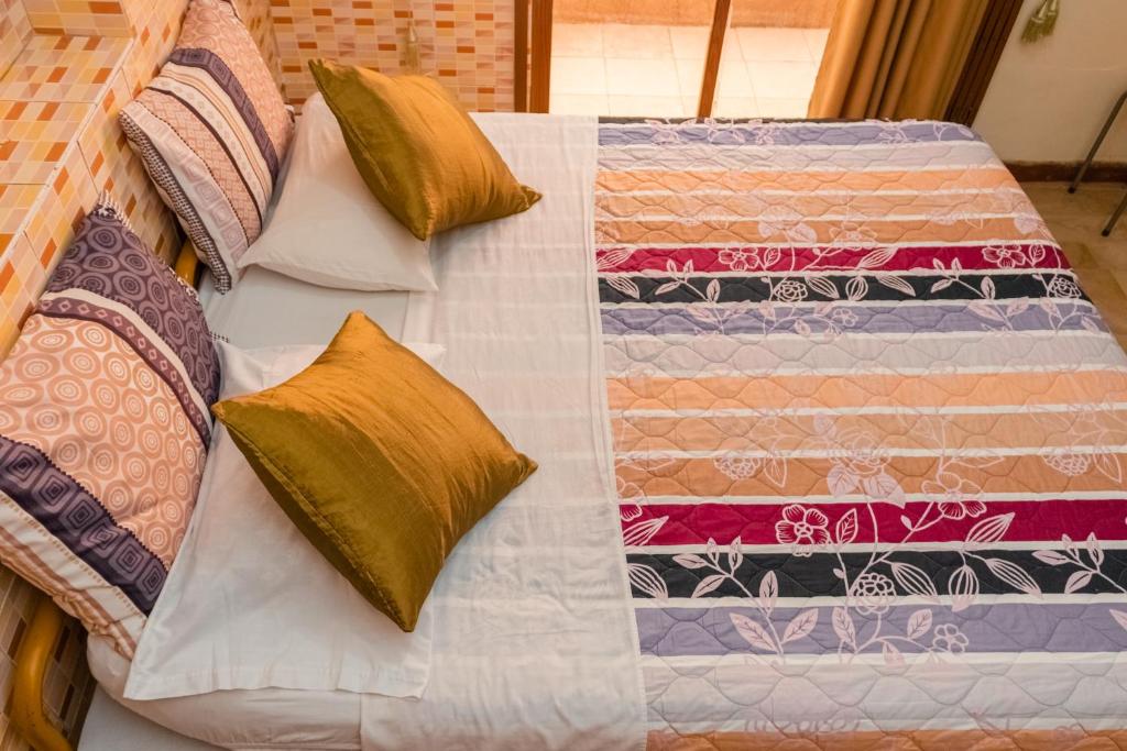 Postel nebo postele na pokoji v ubytování Hotel Livingston Inn