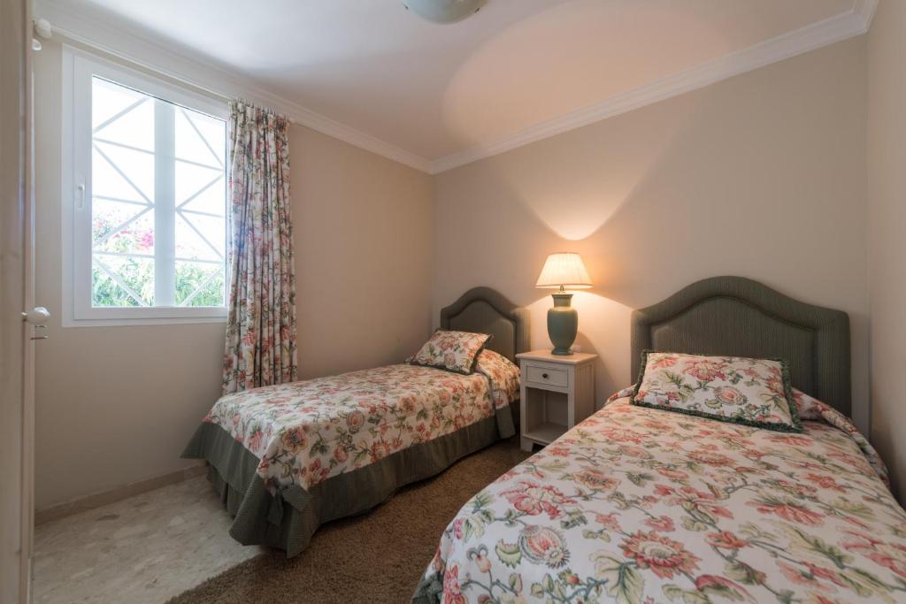 A bed or beds in a room at Casa Maspalomas private pool, Bbq and private parking