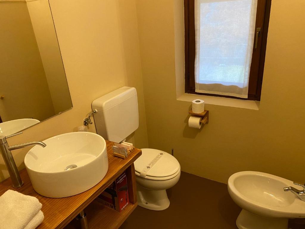 Koupelna v ubytování Hotel Le Clou