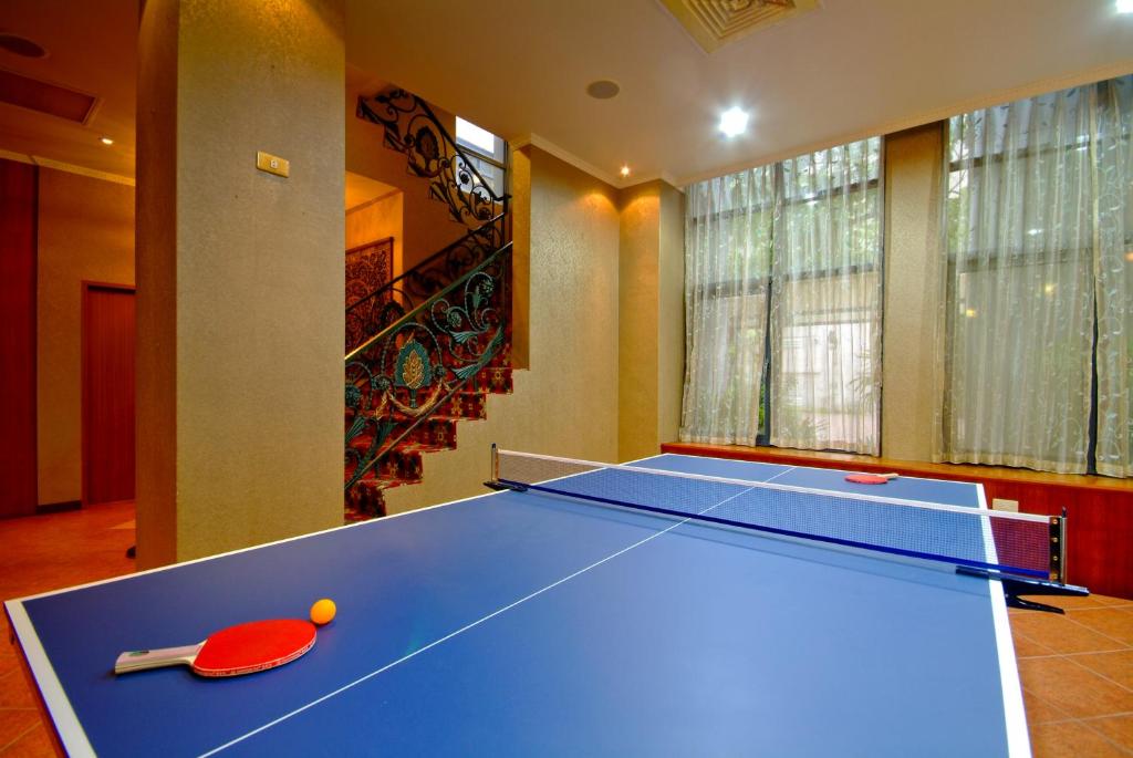 a blue ping pong table in a room at F Hotel Tainan in Tainan