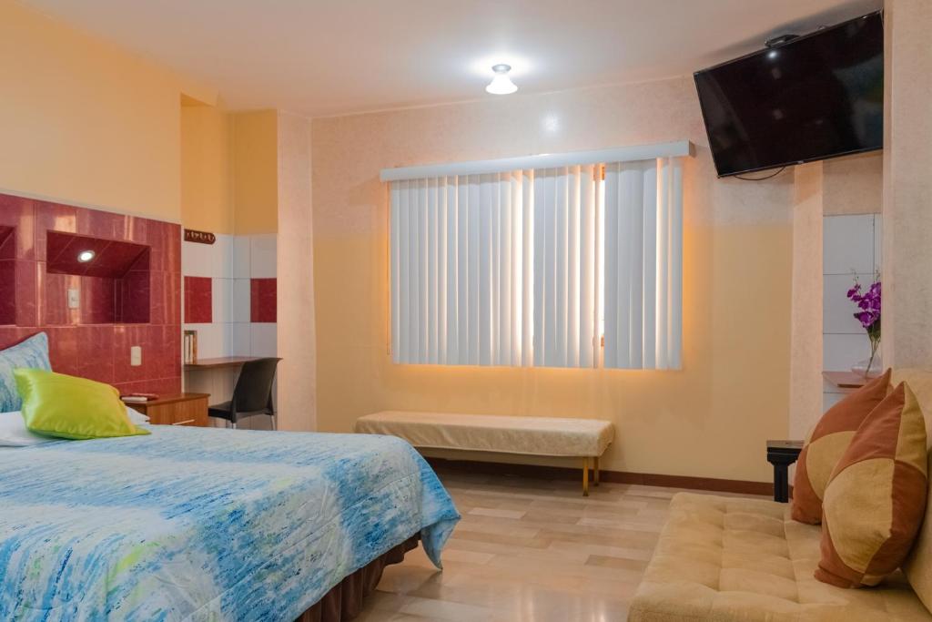 Postel nebo postele na pokoji v ubytování Hotel Livingston Inn