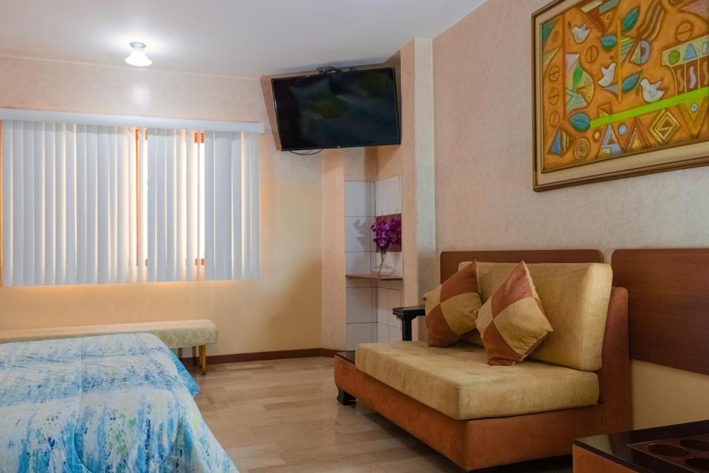 Postel nebo postele na pokoji v ubytování Hotel Livingston Inn
