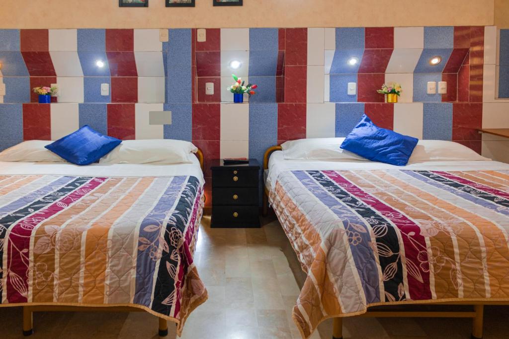 Postel nebo postele na pokoji v ubytování Hotel Livingston Inn