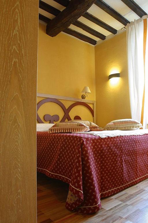 Łóżko lub łóżka w pokoju w obiekcie Albergo Morandi
