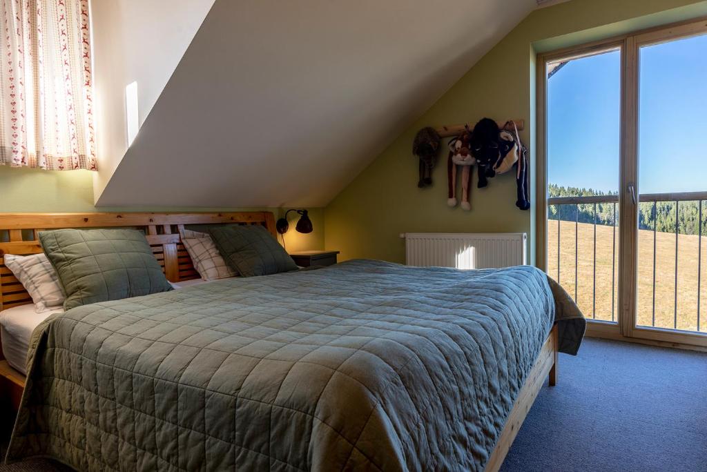 Postel nebo postele na pokoji v ubytování Kvilda Kilián apartmán Javor