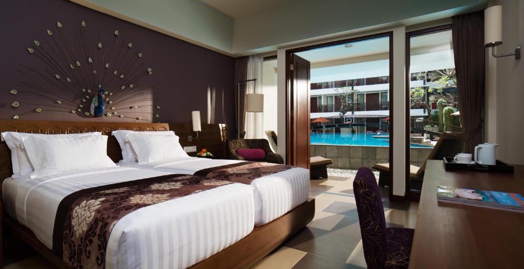 Postel nebo postele na pokoji v ubytování Sun Island Hotel & Spa Kuta