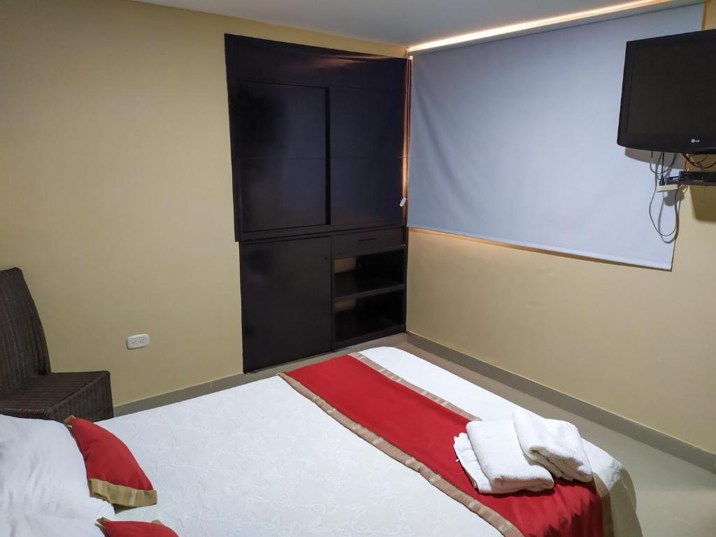 Postel nebo postele na pokoji v ubytování Hotel Plaza Colonial