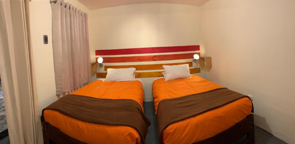 Postel nebo postele na pokoji v ubytování Gaia House Hostel