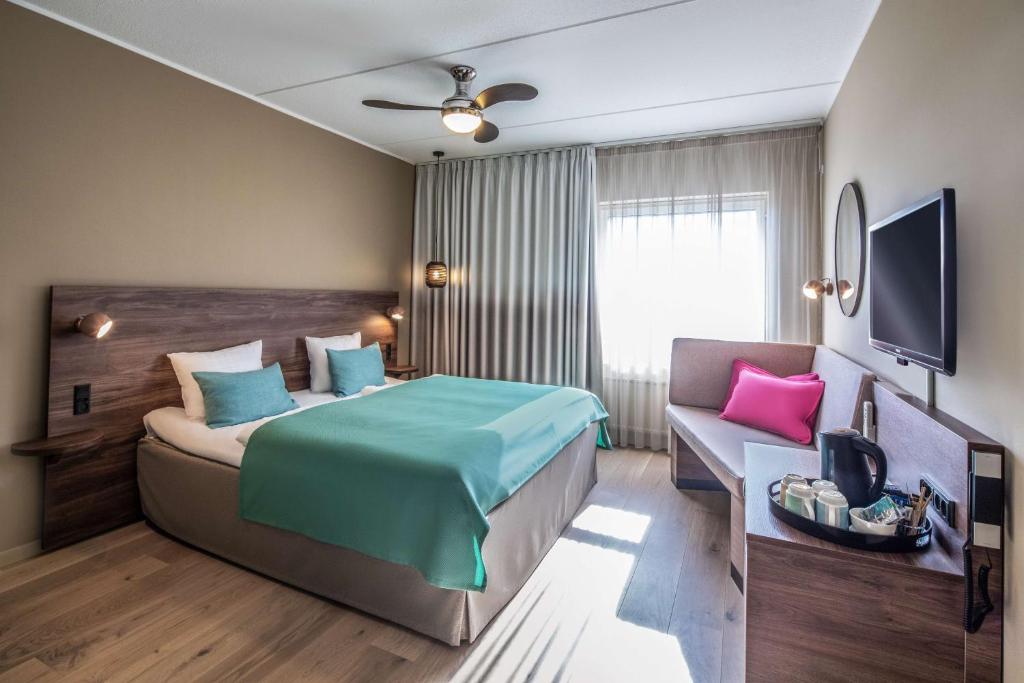 Postel nebo postele na pokoji v ubytování Quality Hotel The Reef