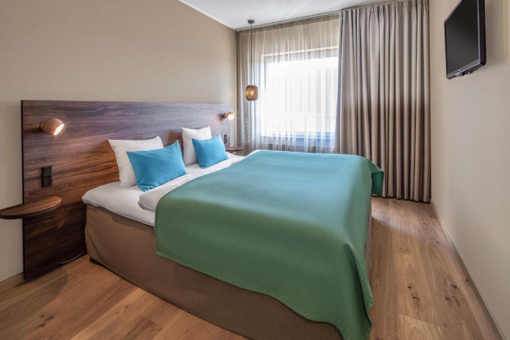 Postel nebo postele na pokoji v ubytování Quality Hotel The Reef