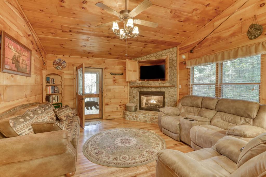 a living room with a couch and a fireplace at Hillside Haven in Blue Ridge