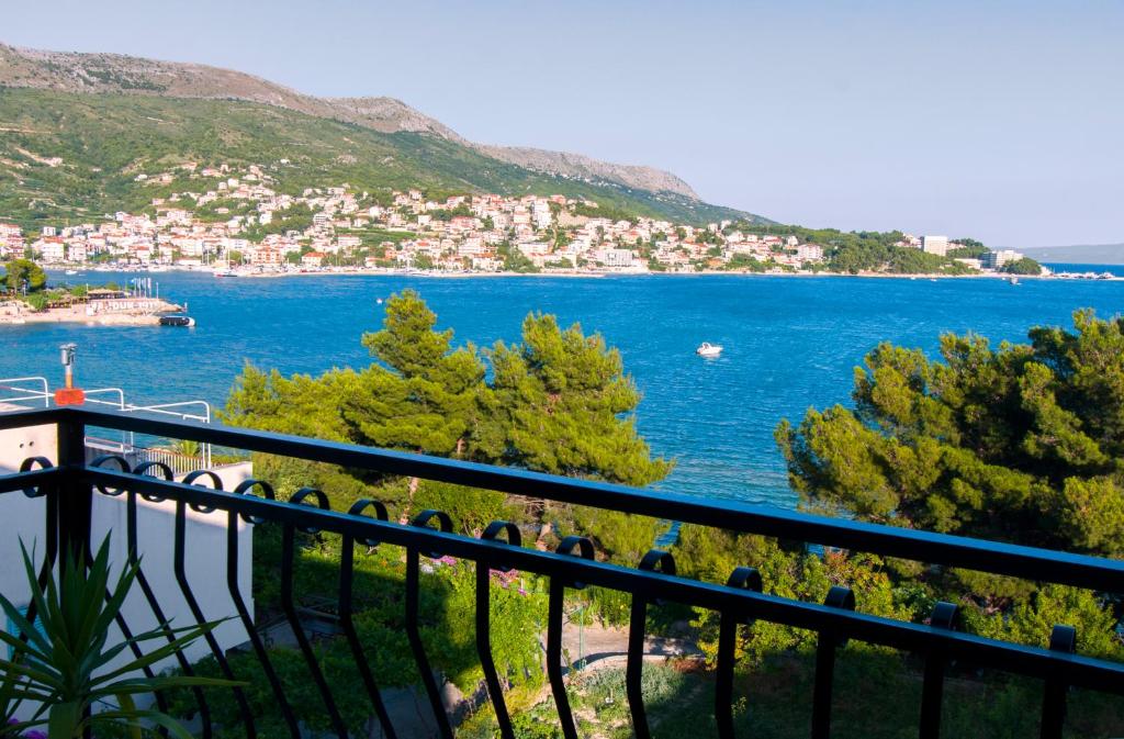 a view of a body of water from a balcony at Rooms & Apartments Bruno in Split
