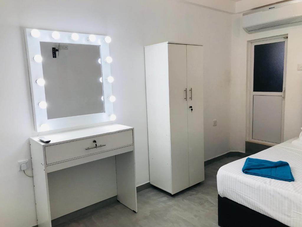 Postel nebo postele na pokoji v ubytování Double Mango Villa