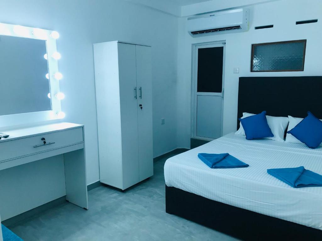 Postel nebo postele na pokoji v ubytování Double Mango Villa